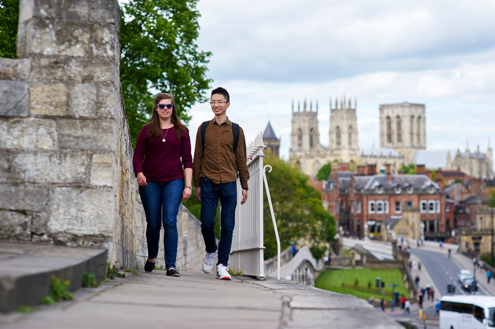 Students walking on the city walls with the Minster in the background